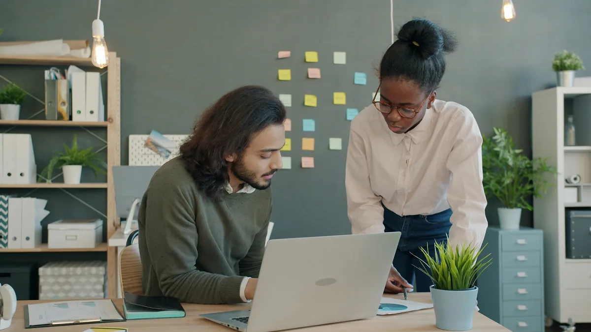 ai agent development basics — team collaborating on whiteboard - Photo by Moe Magners on Pexels