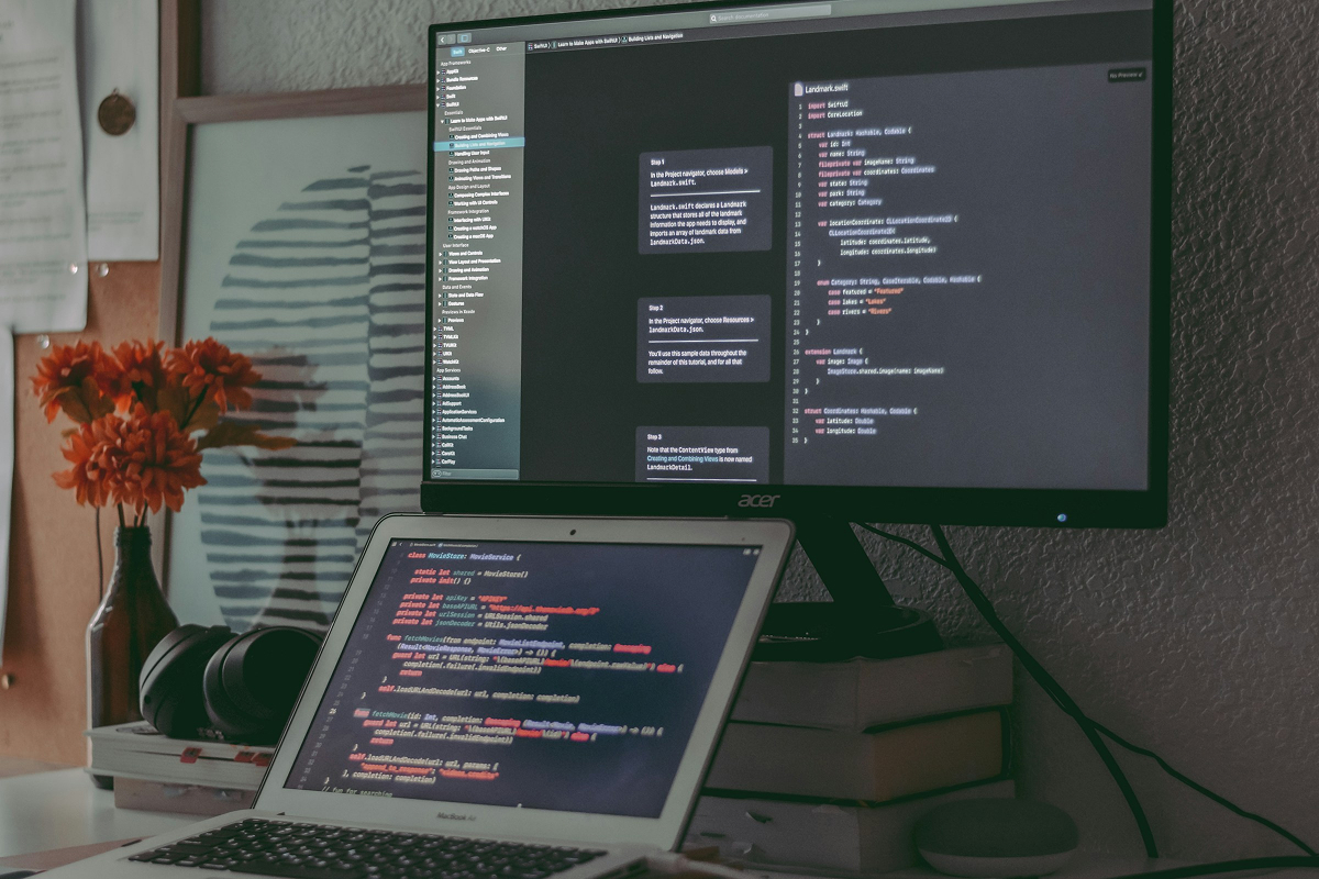 AI agent development — developer working on code at desk - Photo by Lukas Blazek on Pexels