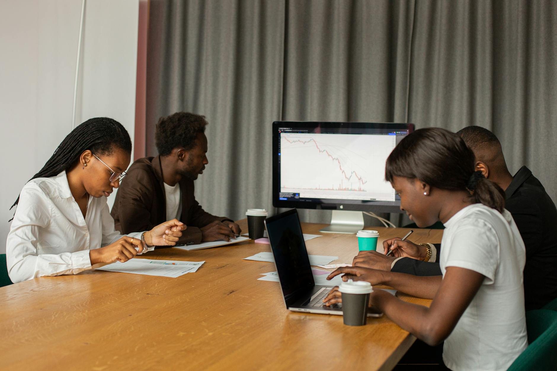 ai development agency in australia — team analyzing performance metrics on a screen - Photo by Monstera Production on Pexels