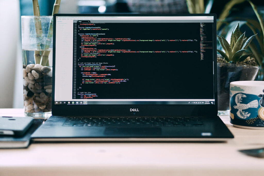 Developer coding an AI SaaS platform for 2026 cost comparison.