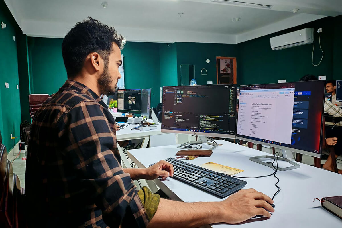 ai-powered software development coding testing and system design — developer working on code at desk - Photo by Zayed Hossain on Pexels
